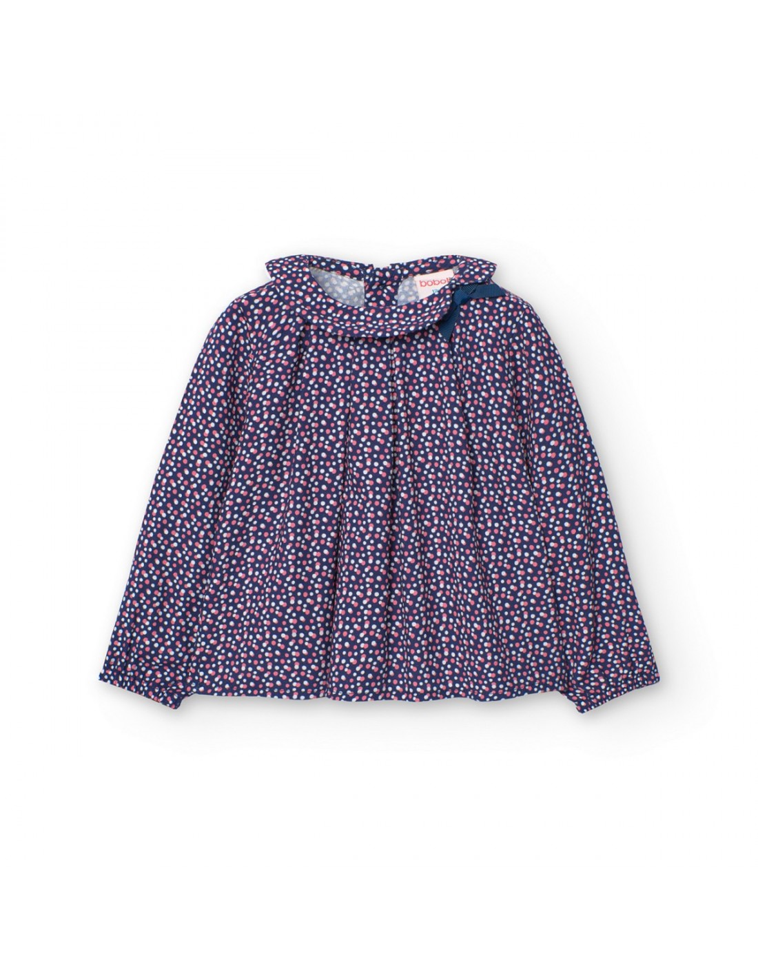 Blusa estampada Boboli de Cachaboo en color azul marino con pequeños lunares, cuello fruncido y detalle de lazo decorativo.