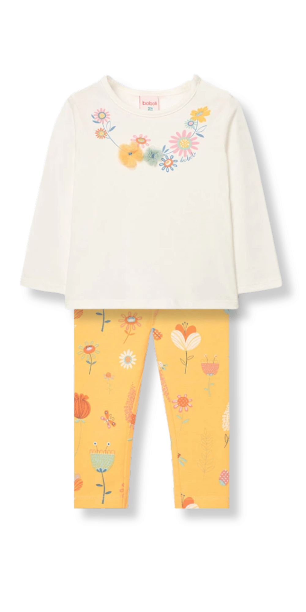 Conjunto infantil de playera blanca de manga larga con bordados florales y leggings amarillos estampados.