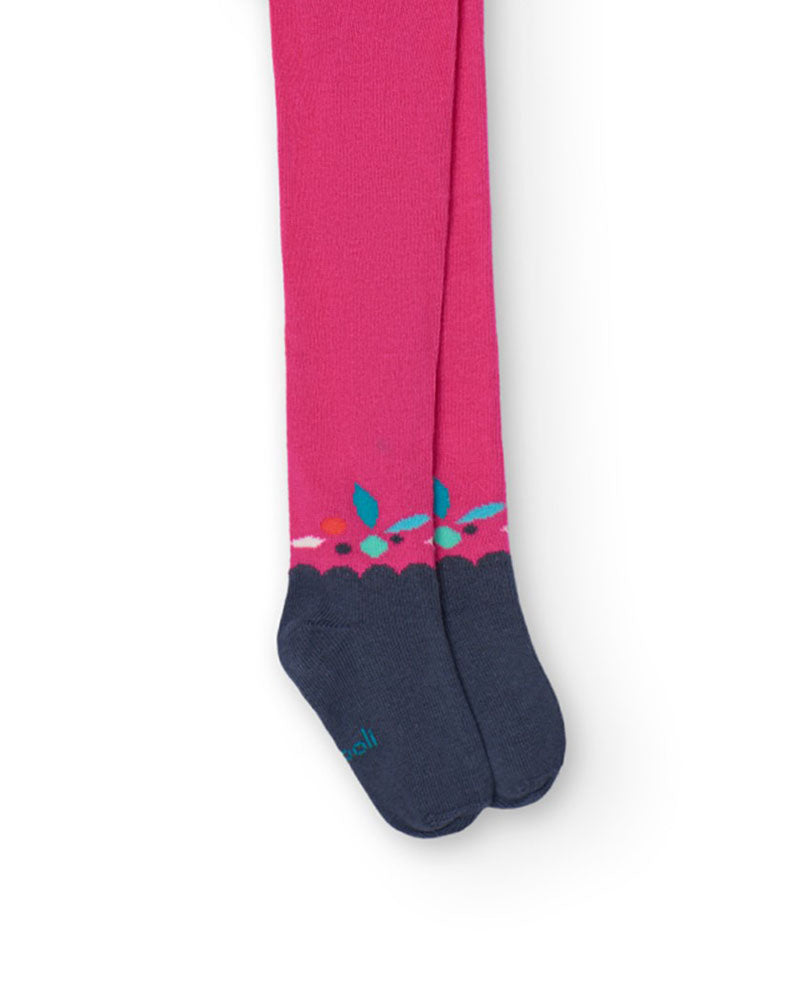 Mallas rosas de niña con puntera azul marino y detalle de hojas de colores en el tobillo.