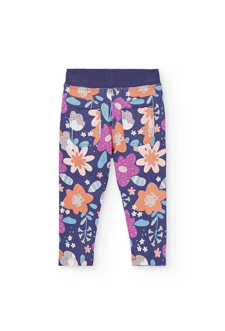 Vista trasera de los leggings florales para niña, mostrando los bolsillos de parche traseros.