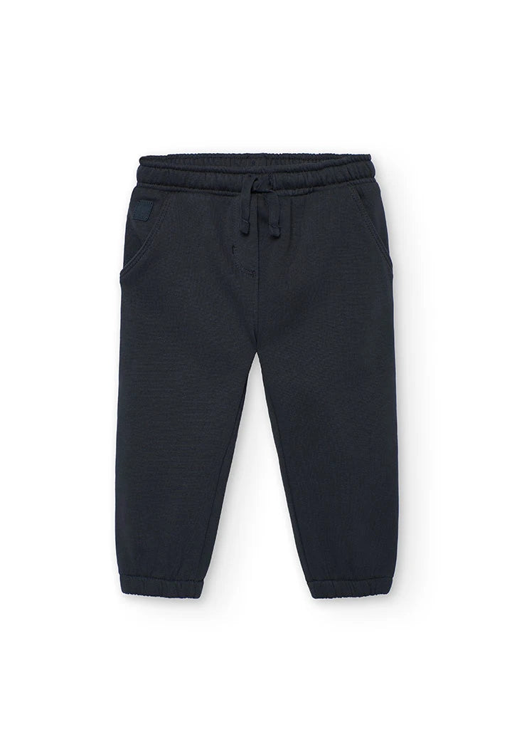 Vista frontal de un pantalón jogger de felpa color carbón para niña, con cintura elástica y cordón.
