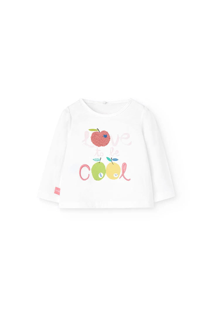 Playera blanca de manga larga para bebé con estampado colorido de frutas y la frase “Love to be Cool”.