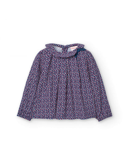 Blusa estampada Boboli de Cachaboo en color azul marino con pequeños lunares, cuello fruncido y detalle de lazo decorativo.