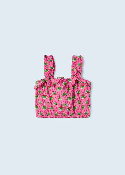 Blusa de tirantes para niña en color rosa con estampado tropical de frutas y volantes en los tirantes. Diseño ligero y fresco, ideal para los días de verano.
