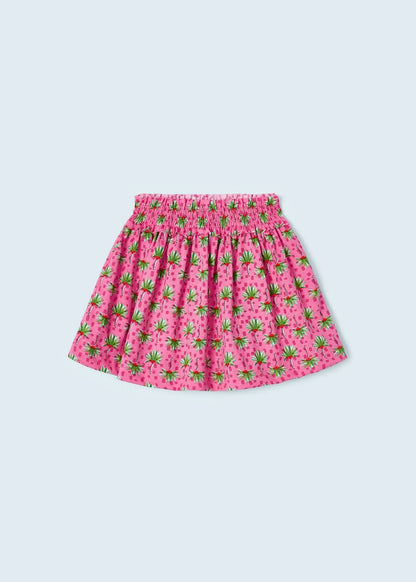 Falda rosa para niña con estampado tropical de frutas y cintura elástica fruncida. Diseño ligero y cómodo, perfecto para los días cálidos.