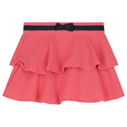 Falda rosa Boboli de Cachaboo con volantes en capas, cinturilla decorada con lazo y diseño elegante para niñas.