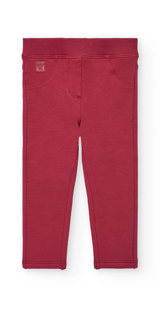 Vista frontal de unos jeggings de felpa para niña en color guinda, con cintura elástica y diseño de cinco bolsillos, marca Boboli.