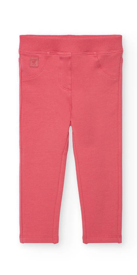 Vista frontal de unos leggings de felpa para niña en color rosa, con cintura elástica y diseño de cinco bolsillos, marca Boboli.

