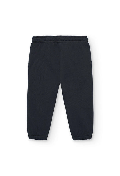 Vista trasera del pantalón jogger de felpa color carbón para niña.