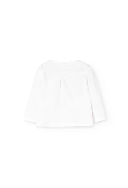 Playera blanca de manga larga para bebé vista desde la parte trasera, confeccionada en tela de algodón.