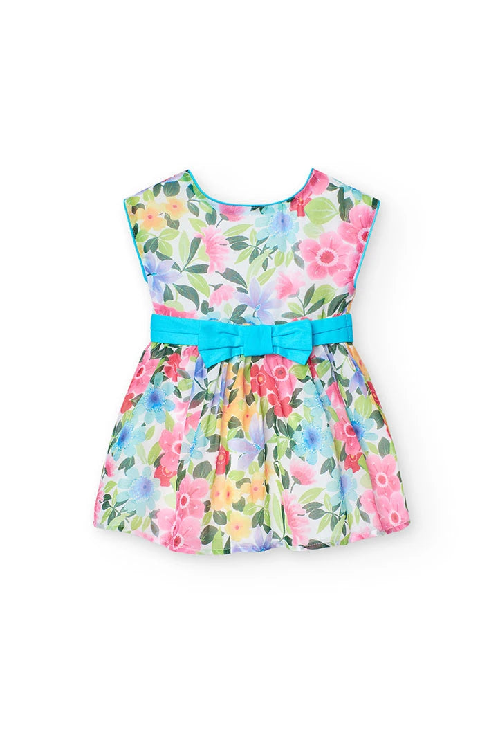 Vestido de gasa con estampado floral y lazo azul en la cintura, diseñado para niñas con un estilo fresco y elegante.